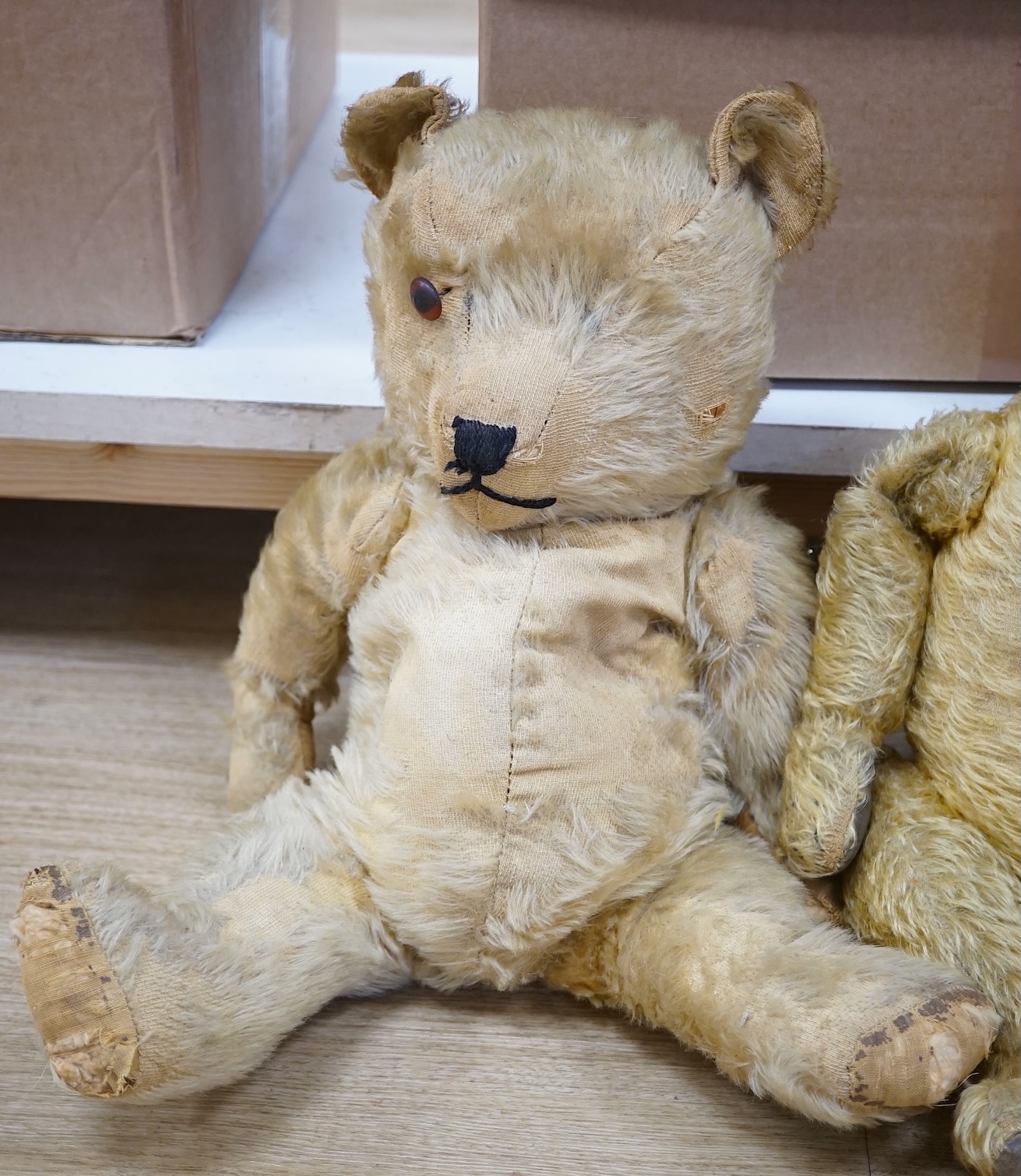 A Chiltern bear c.1950's, 55cm, tear to one velvet pad otherwise in good condition, and a 1930's bear, 50cm, repaired paw pads and nose